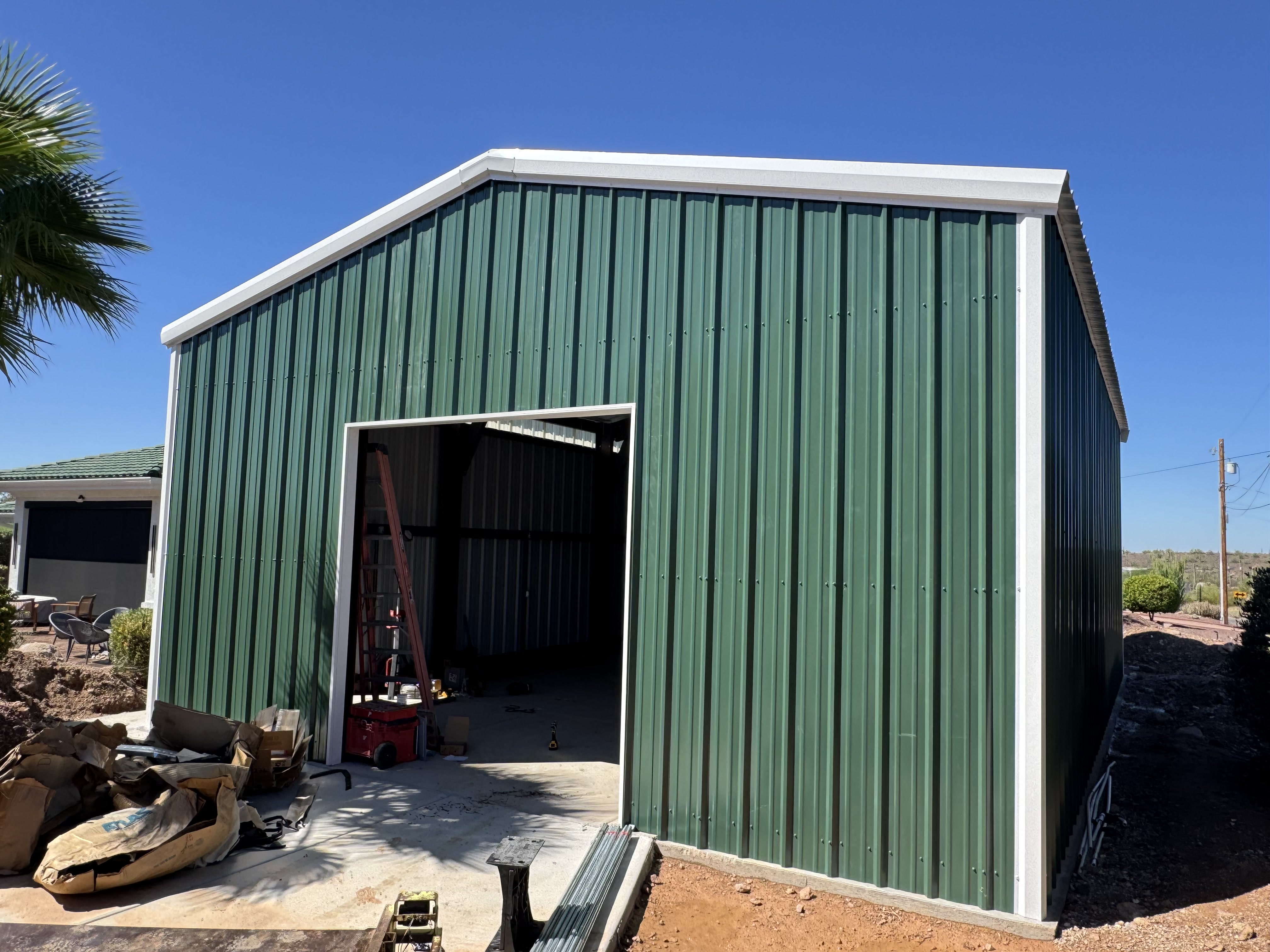 28 × 40 × 14 ft green steel building — front exterior